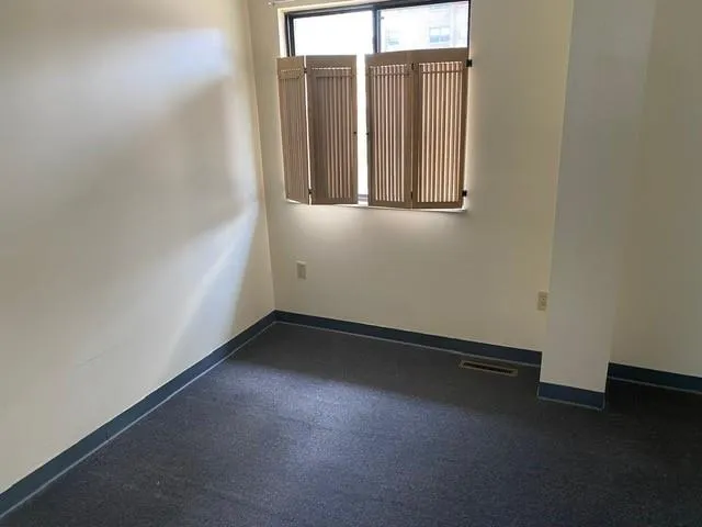 an empty room with windows