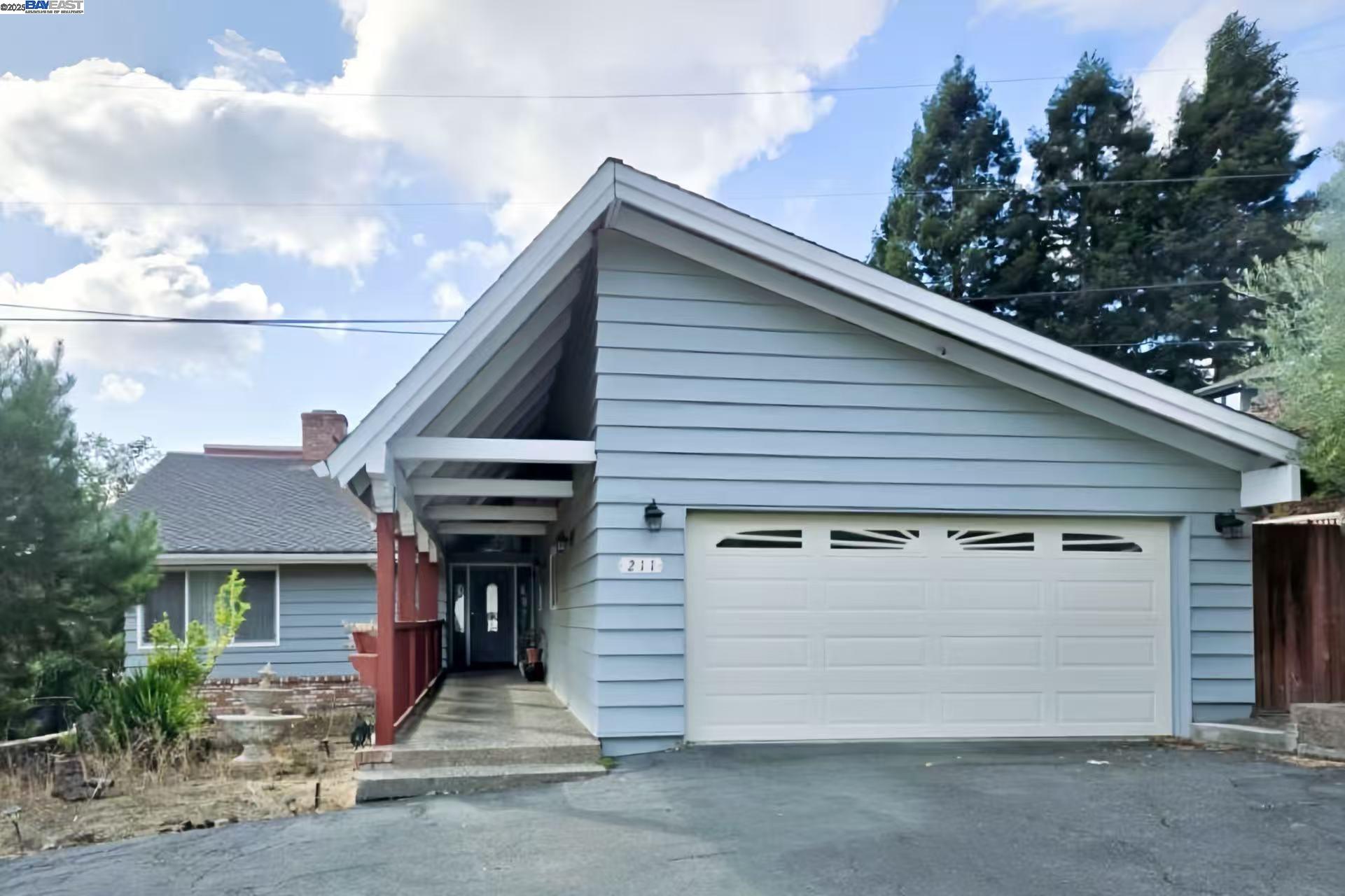a front view of a house with a garage