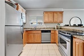 3009 Speedway, Unit 3 Austin, TX 78705 - Photo 11 of 21 a kitchen with stainless steel appliances granite countertop a stove a sink and a refrigerator