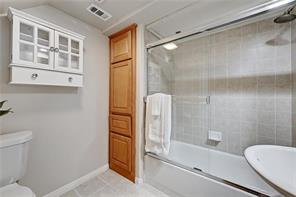 3009 Speedway, Unit 3 Austin, TX 78705 - Photo 16 of 21 a bathroom with a bathtub and a shower