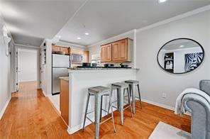 3009 Speedway, Unit 3 Austin, TX 78705 - Photo 6 of 21 a kitchen with stainless steel appliances granite countertop a table and chairs