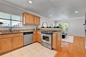 3009 Speedway, Unit 3 Austin, TX 78705 - Photo 7 of 21 a kitchen with granite countertop a stove sink and cabinets