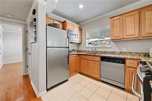 3009 Speedway, Unit 3 Austin, TX 78705 - Photo 8 of 21 a kitchen with stainless steel appliances granite countertop a refrigerator sink and cabinets
