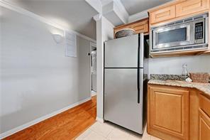 3009 Speedway, Unit 3 Austin, TX 78705 - Photo 10 of 21 a kitchen with a refrigerator and microwave