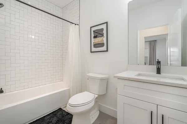 a bathroom with a shower and a bathtub