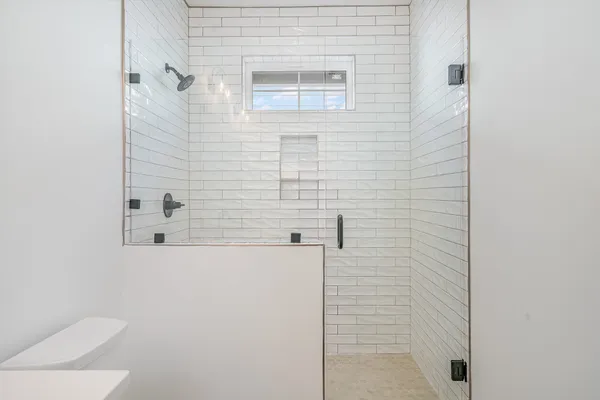 a bedroom with furniture and wooden floor