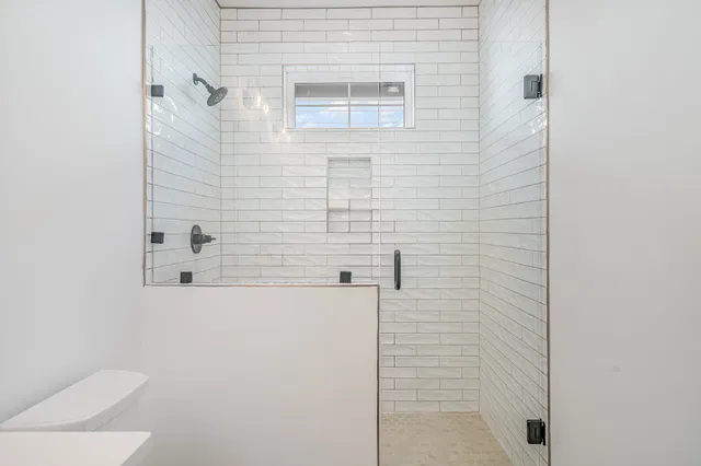 a bedroom with furniture and wooden floor