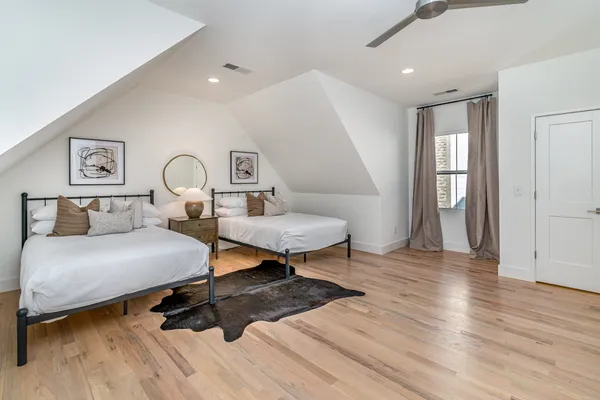 a bedroom with a bed and a table in it