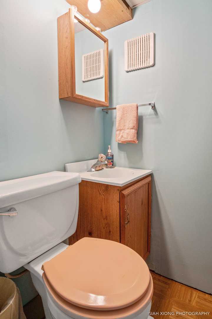 91 Neil Road Sugar Grove, IL 60554 - Photo 26 of 31 a white toilet sitting next to a bathroom sink