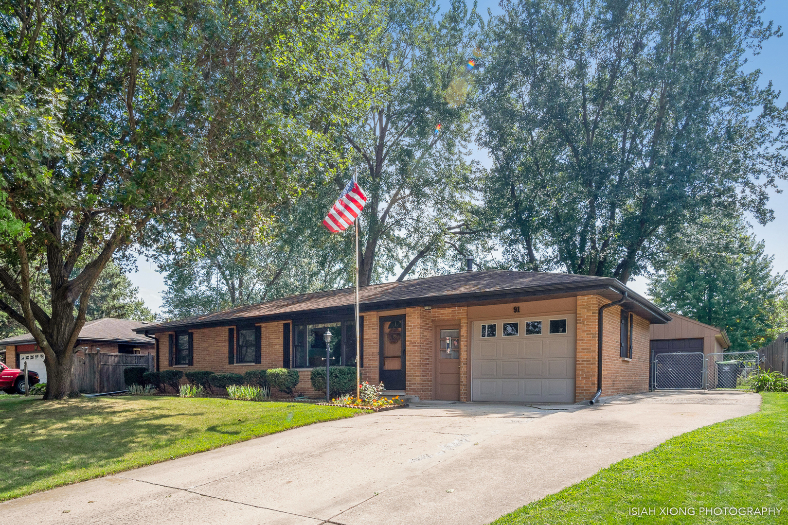 91 Neil Road Sugar Grove, IL 60554 - Photo 30 of 31 a front view of a house with a yard and garage