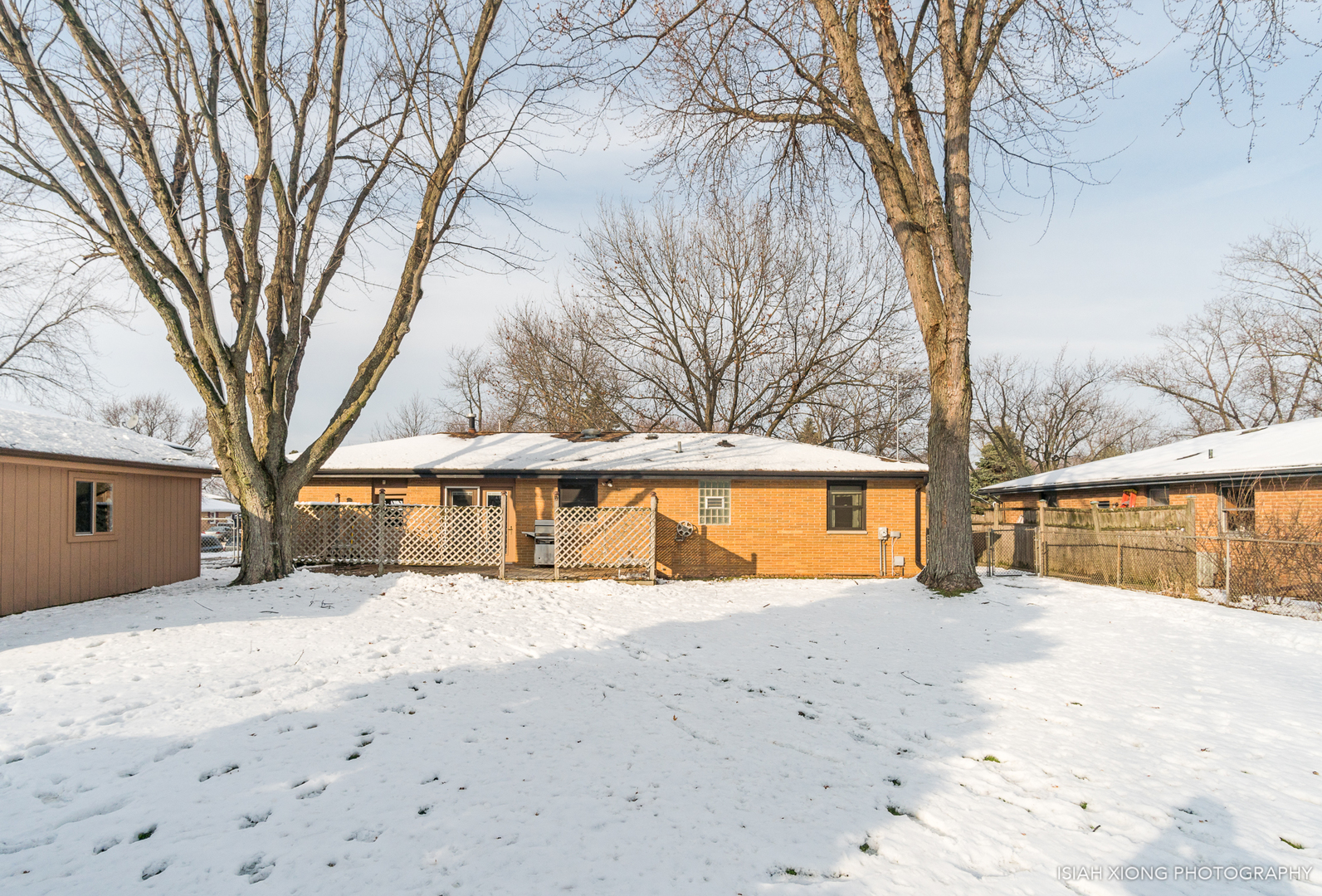 91 Neil Road Sugar Grove, IL 60554 - Photo 5 of 31 a view of large trees with a snow in front of house