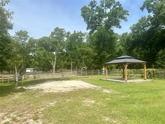 a view of a swimming pool with a yard
