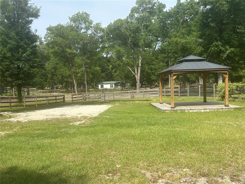 9290 Northwest 125th Avenue Ocala, FL 34482 - Photo 12 of 23 a view of a house with a yard