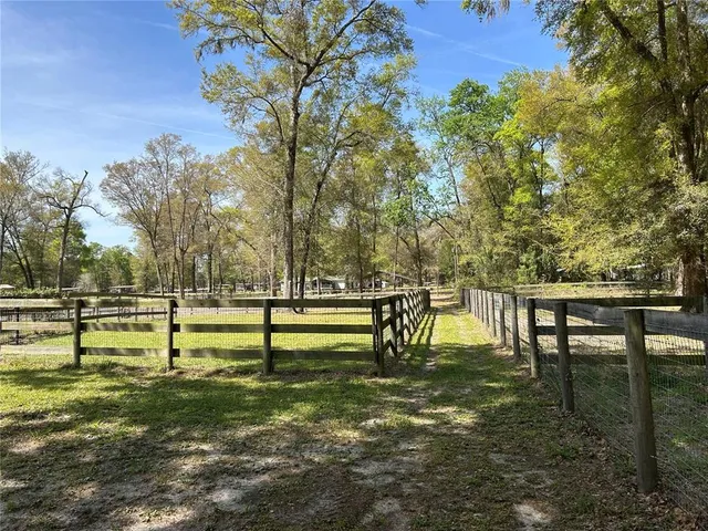 a view of swimming pool with a bench