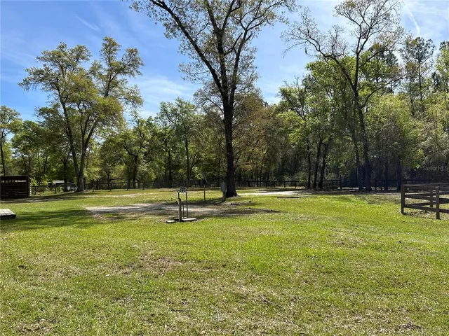 a swimming pool with wooden fence