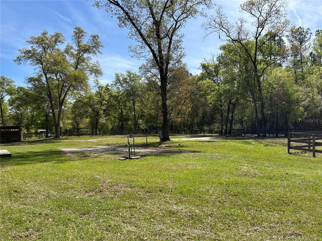 9290 Northwest 125th Avenue Ocala, FL 34482 - Photo 19 of 23 a swimming pool with wooden fence