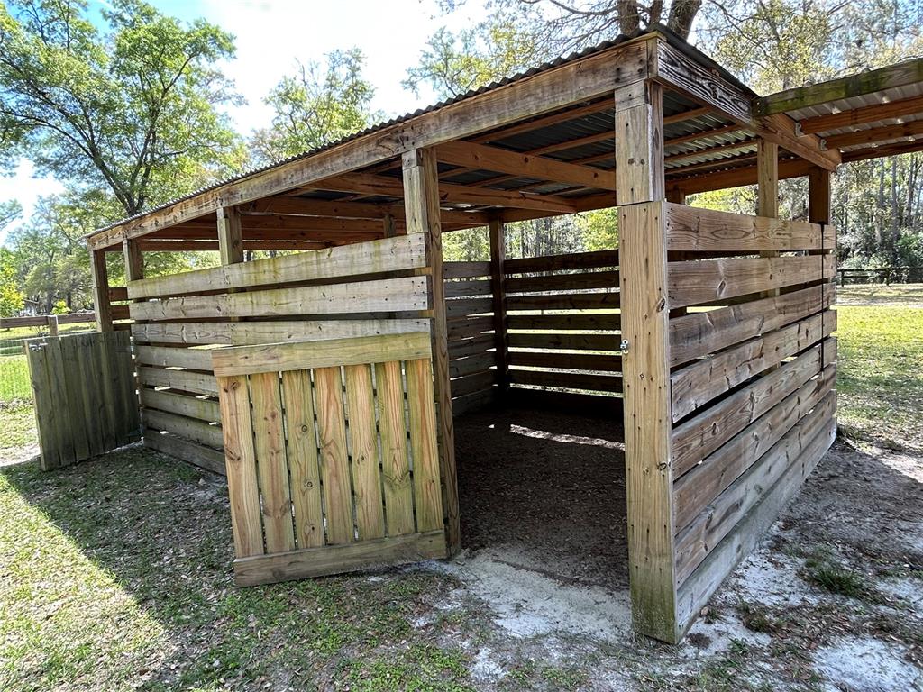 9290 Northwest 125th Avenue Ocala, FL 34482 - Photo 7 of 23 a view of a house with a wooden door