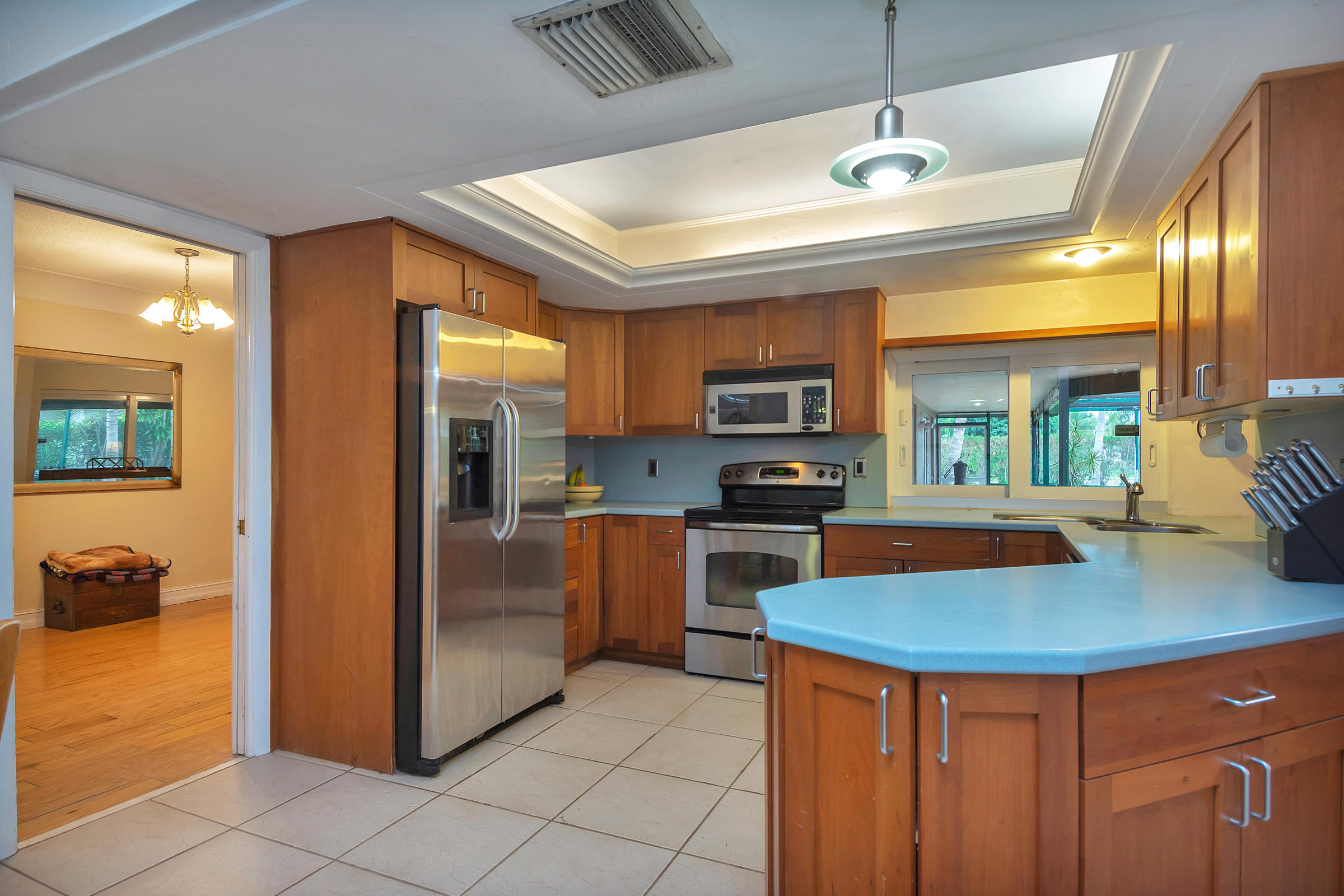 400 Northwest 11th Street Boca Raton, FL 33432 - Photo 13 of 42 a kitchen with stainless steel appliances granite countertop a sink a stove and refrigerator