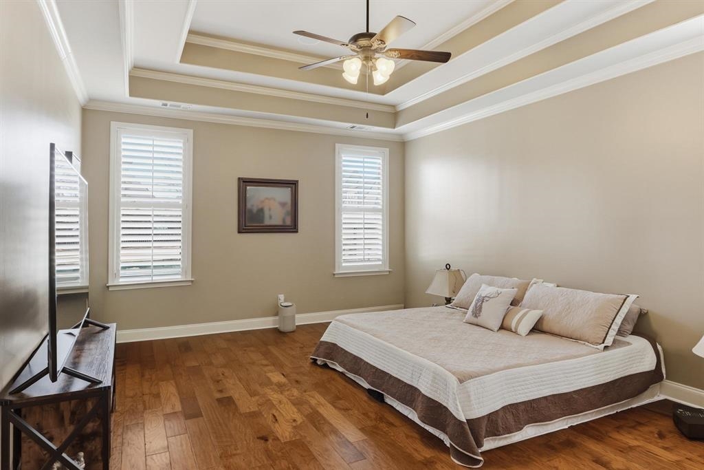 1301 Conser Street Collierville, TN 38017 - Photo 15 of 39 a bedroom with a bed and a chandelier
