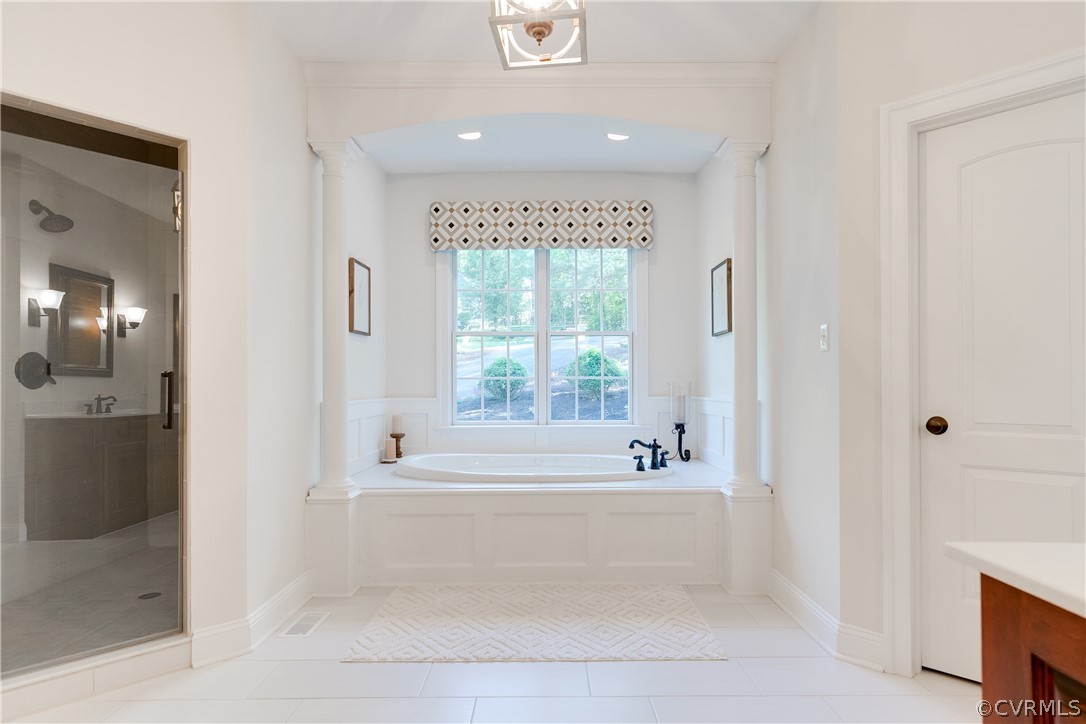 14641 West Salisbury Road Midlothian, VA 23113 - Photo 24 of 50 a bathroom with a bathtub and a shower