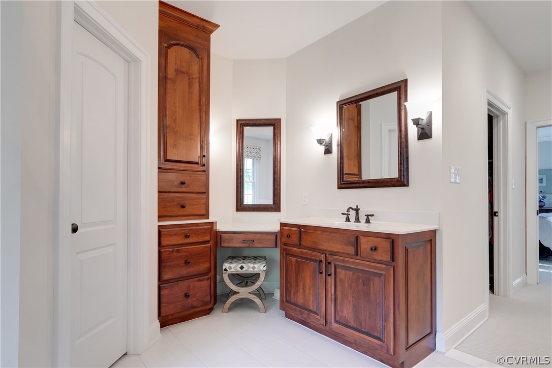 14641 West Salisbury Road Midlothian, VA 23113 - Photo 26 of 50 a bathroom with a sink and a mirror