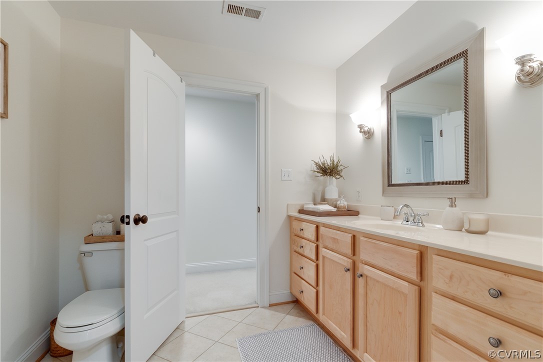 14641 West Salisbury Road Midlothian, VA 23113 - Photo 31 of 50 a bathroom with a toilet a sink a mirror and a bathtub
