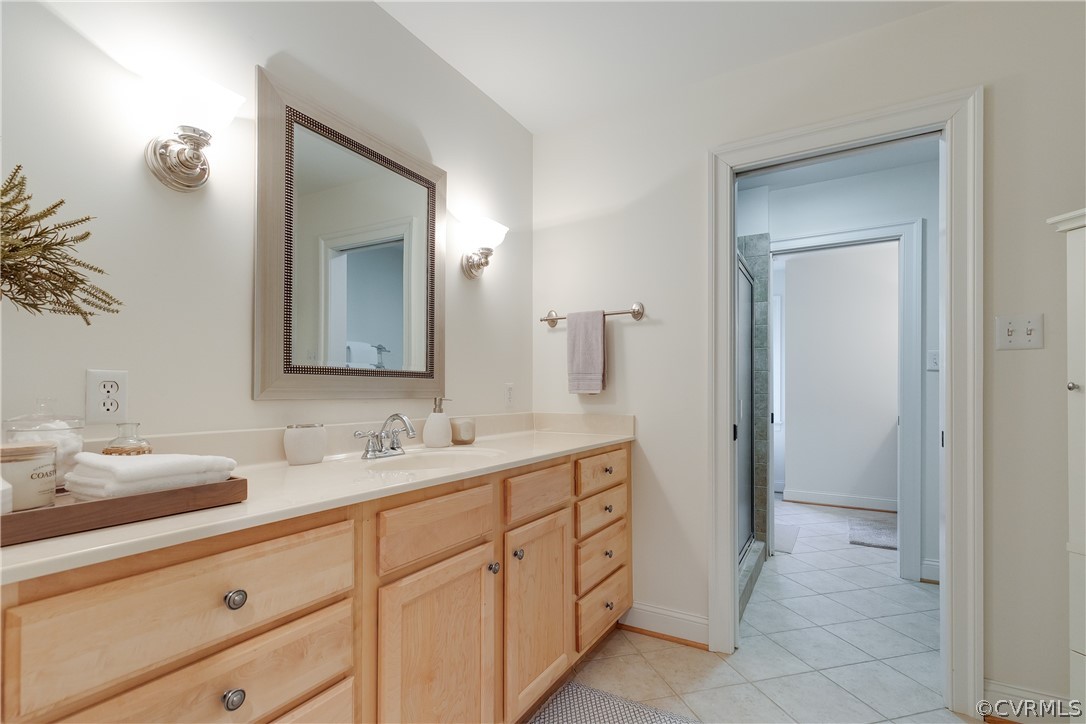14641 West Salisbury Road Midlothian, VA 23113 - Photo 32 of 50 a bathroom with a double vanity sink and a mirror
