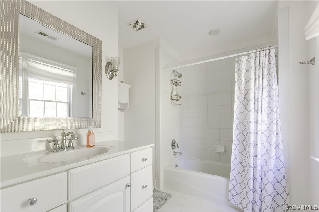 14641 West Salisbury Road Midlothian, VA 23113 - Photo 34 of 50 a bathroom with a granite countertop sink a mirror a shower and a bathtub