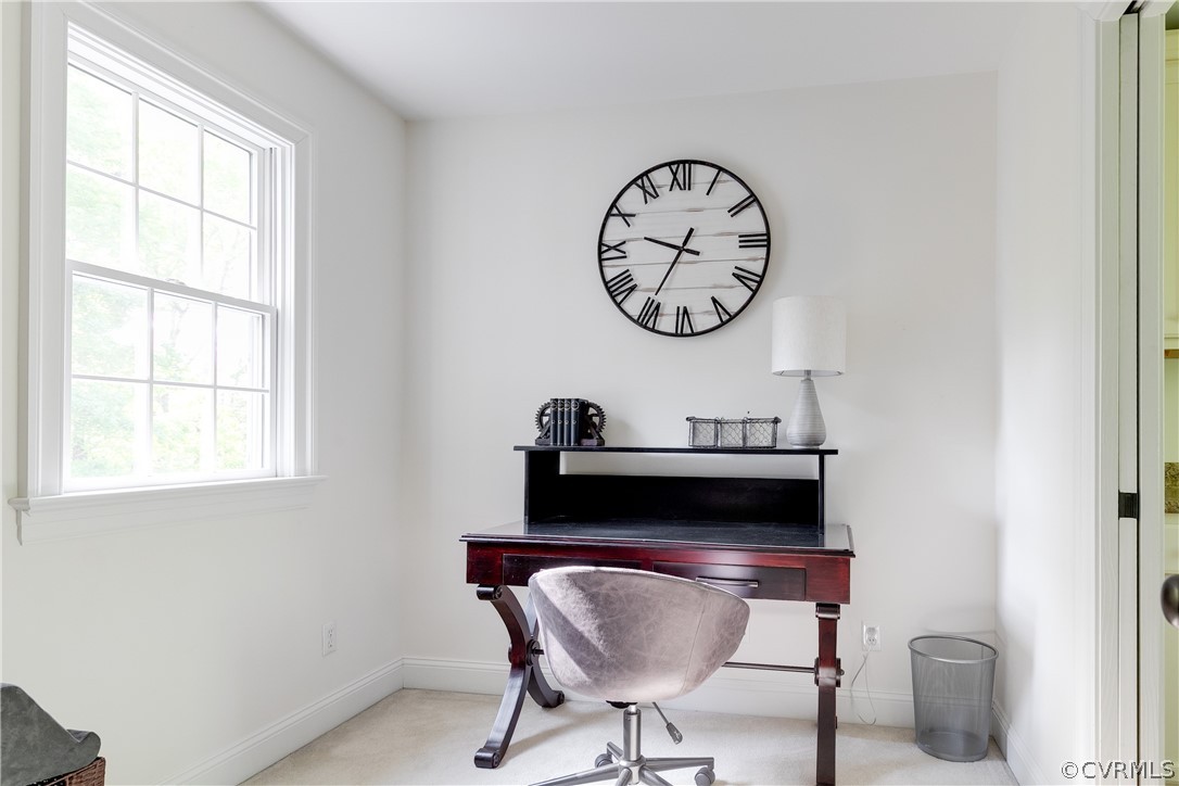 14641 West Salisbury Road Midlothian, VA 23113 - Photo 36 of 50 a living room with a table and a chair