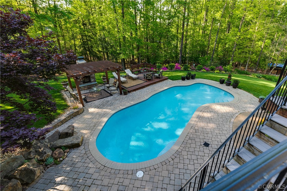 14641 West Salisbury Road Midlothian, VA 23113 - Photo 43 of 50 a view of a swimming pool with a porch and furniture