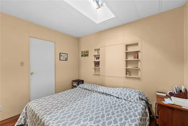 a bedroom with a bed and a cabinets