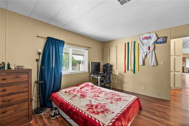 a bedroom with a bed and a dresser