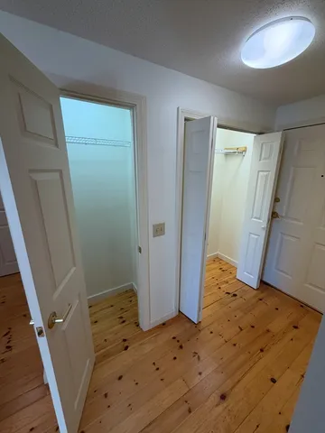 a view of a hallway to a bedroom
