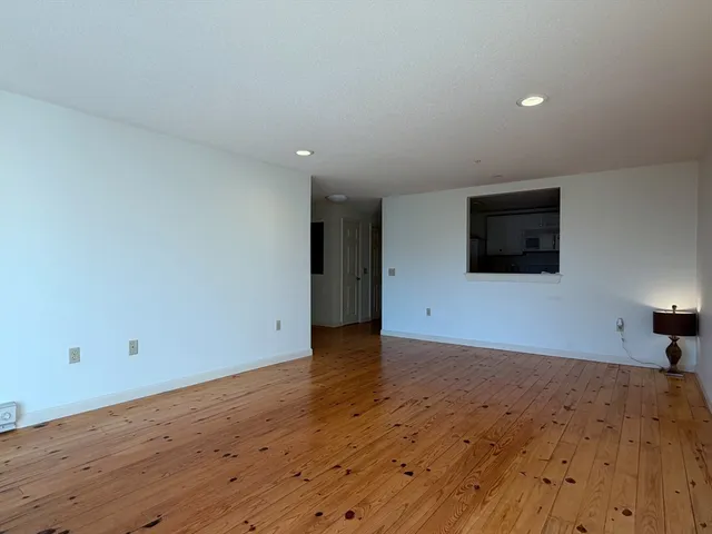 a view of a livingroom with wooden floor
