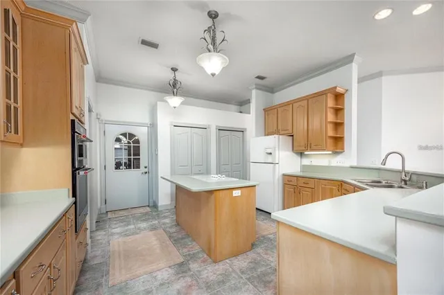 a view of a livingroom with a ceiling fan and window