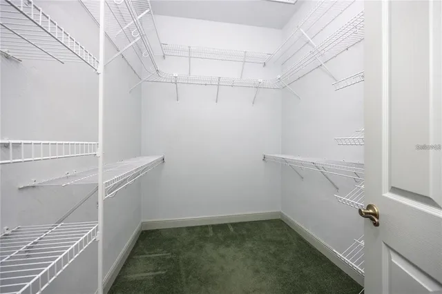 a white house sitting in middle of the grass