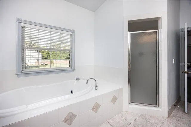 a view of a house with a yard porch and sitting area