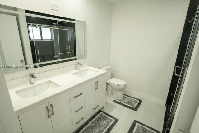 10210 Southwest 133rd Court Miami, FL 33186 - Photo 16 of 30 a bathroom with a sink and a mirror