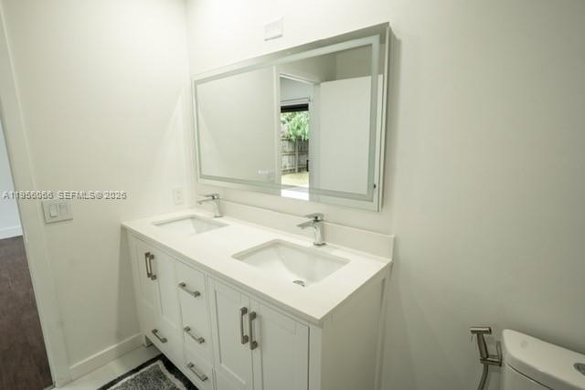 10210 Southwest 133rd Court Miami, FL 33186 - Photo 17 of 30 a bathroom with a sink and a mirror