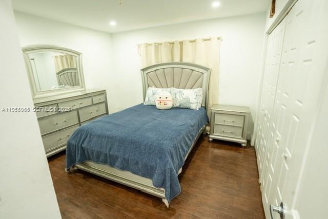 10210 Southwest 133rd Court Miami, FL 33186 - Photo 18 of 30 a bedroom with a bed and window