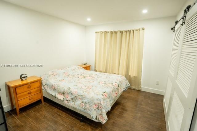 10210 Southwest 133rd Court Miami, FL 33186 - Photo 19 of 30 a bedroom with a bed and a window