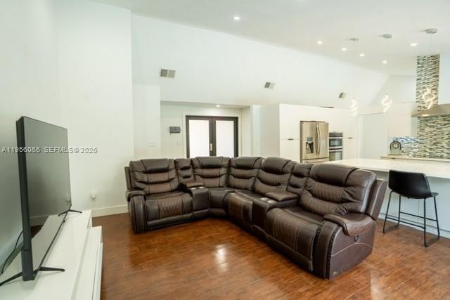 10210 Southwest 133rd Court Miami, FL 33186 - Photo 2 of 30 a living room with furniture and a flat screen tv