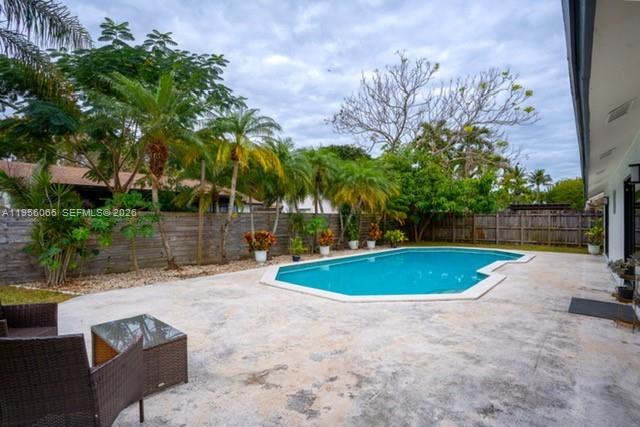 10210 Southwest 133rd Court Miami, FL 33186 - Photo 22 of 30 a view of a backyard with swimming pool