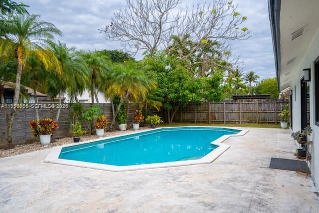 10210 Southwest 133rd Court Miami, FL 33186 - Photo 23 of 30 a view of a swimming pool with a patio