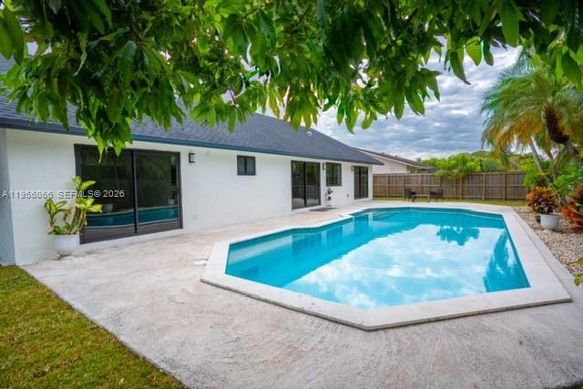10210 Southwest 133rd Court Miami, FL 33186 - Photo 24 of 30 a view of a house with swimming pool