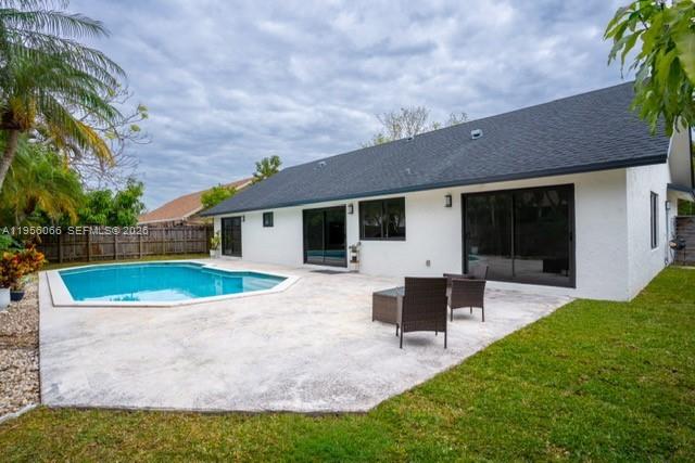 10210 Southwest 133rd Court Miami, FL 33186 - Photo 26 of 30 a view of a house with a yard patio and a garden