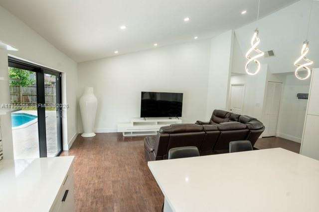 10210 Southwest 133rd Court Miami, FL 33186 - Photo 3 of 30 a living room with furniture and a flat screen tv