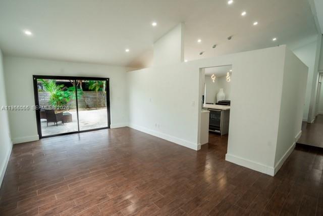 10210 Southwest 133rd Court Miami, FL 33186 - Photo 4 of 30 a view of an empty room with wooden floor and a window