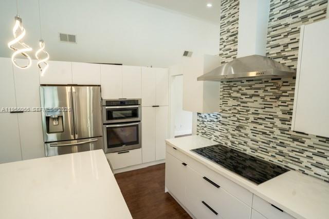 10210 Southwest 133rd Court Miami, FL 33186 - Photo 8 of 30 a kitchen with a stove and a refrigerator