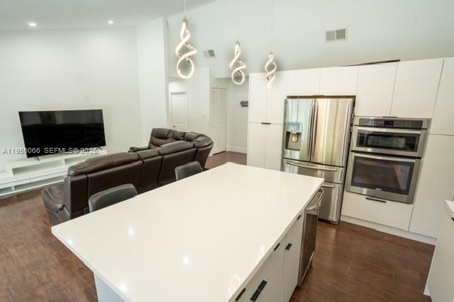 10210 Southwest 133rd Court Miami, FL 33186 - Photo 9 of 30 a kitchen with cabinets and stainless steel appliances